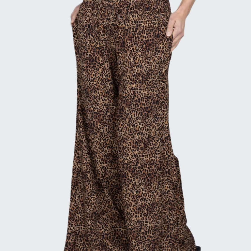 Leopard print wide-leg pants worn by a person on a white background