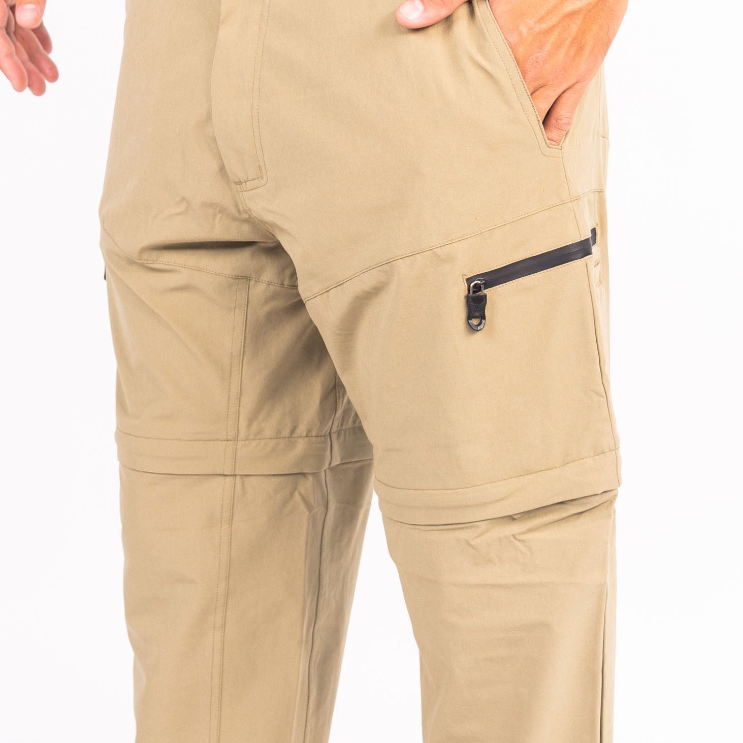 Beige pants with a zipper pocket on a white background
