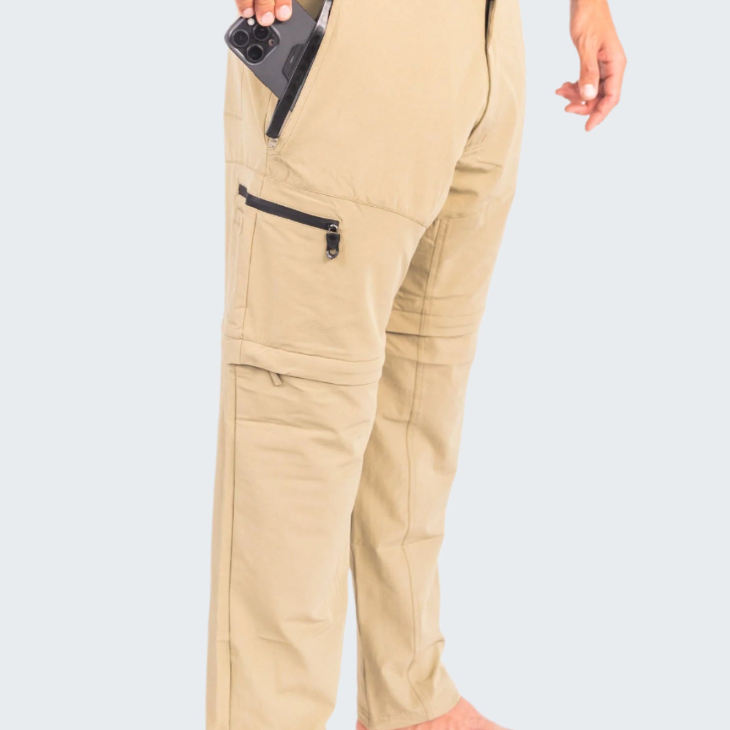 Beige pants with zippers on a white background