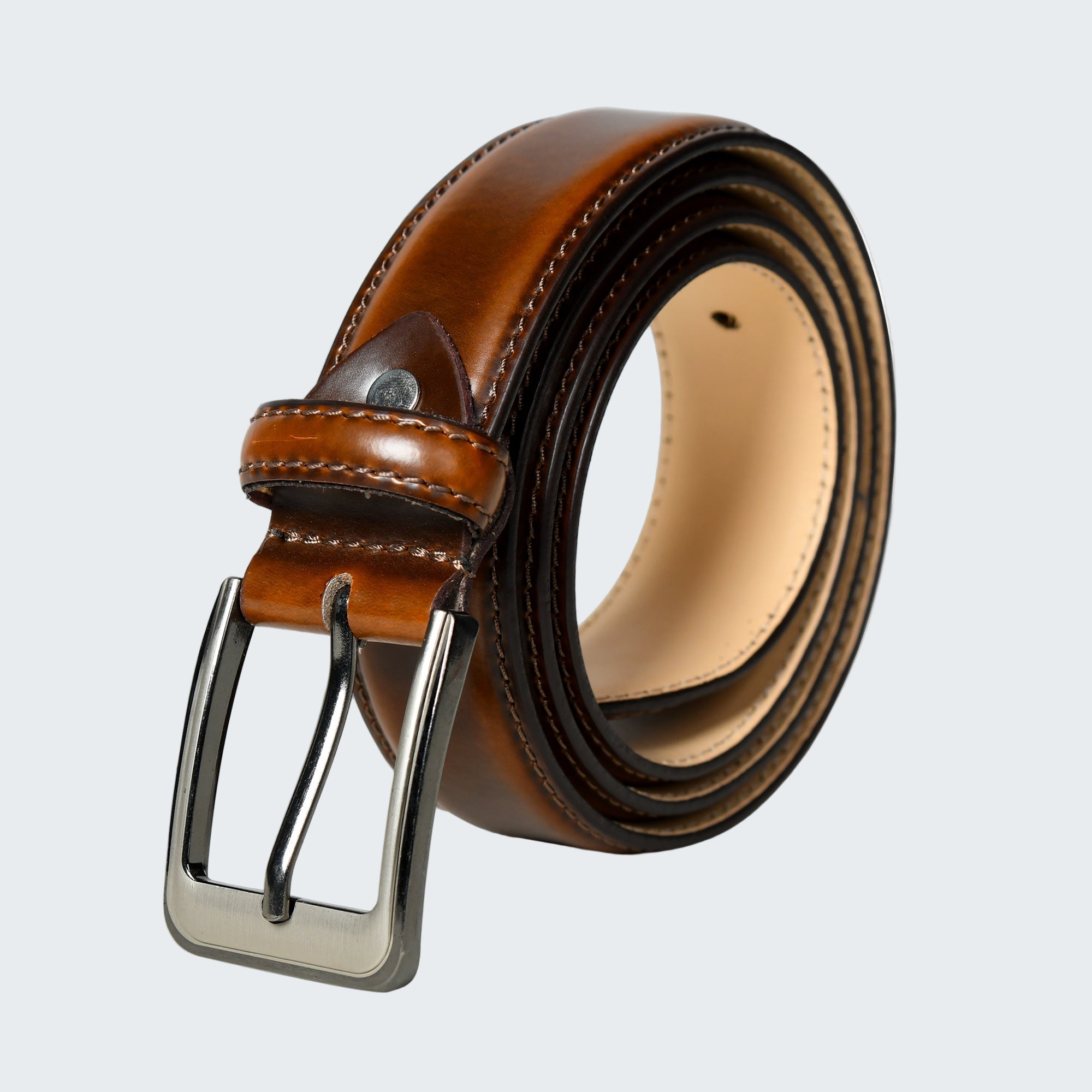 Brown leather belt with silver buckle on a white background