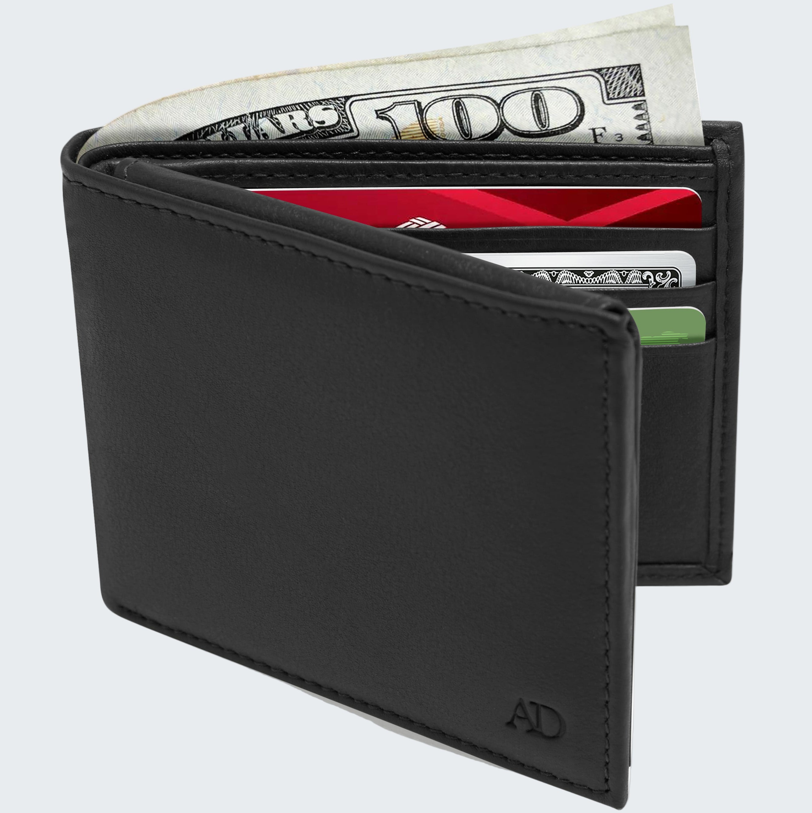 Black leather wallet with money and cards on a white background