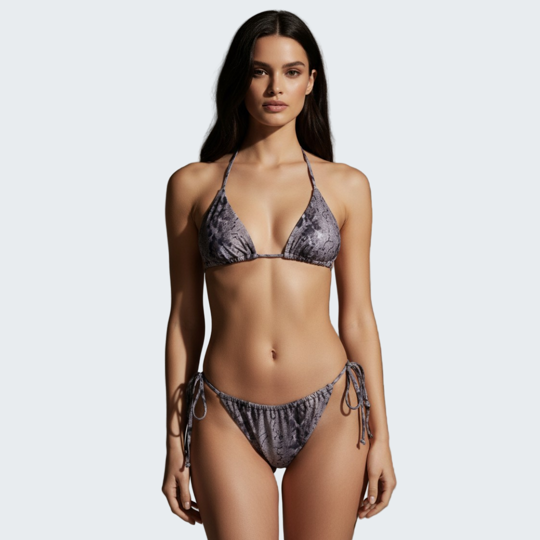 Woman wearing a patterned bikini against a neutral background