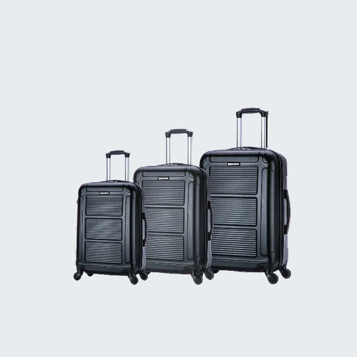 Set of three black suitcases of different sizes on a white background