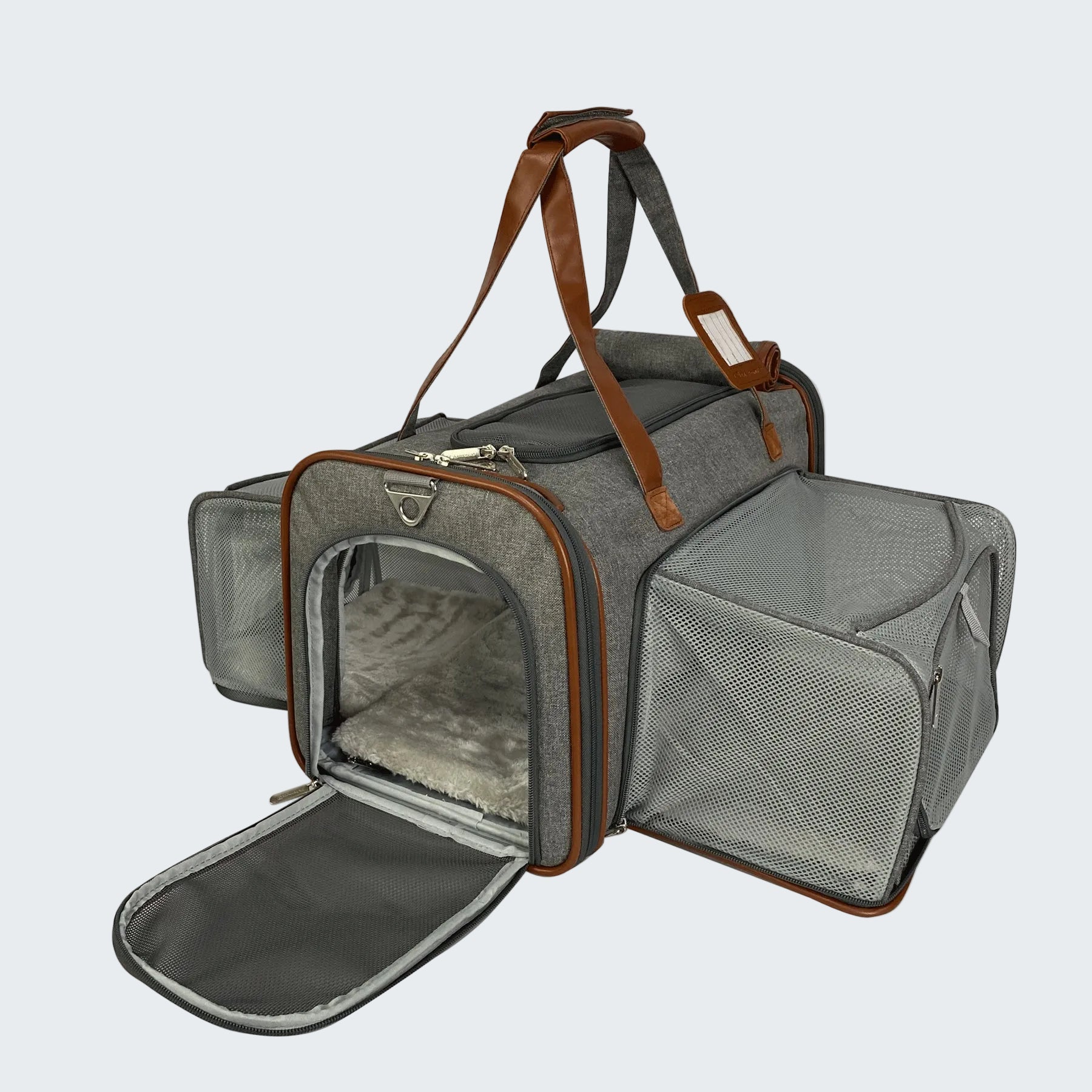 Gray pet carrier with brown straps on a white background