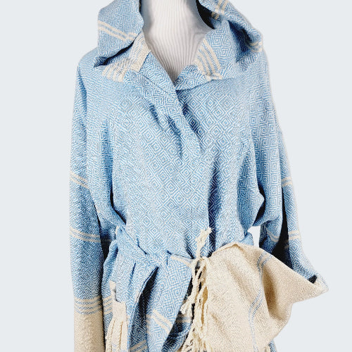 Light blue textured garment with white accents on a neutral background