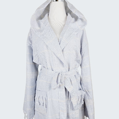 Light gray hooded robe on a mannequin against a beige background