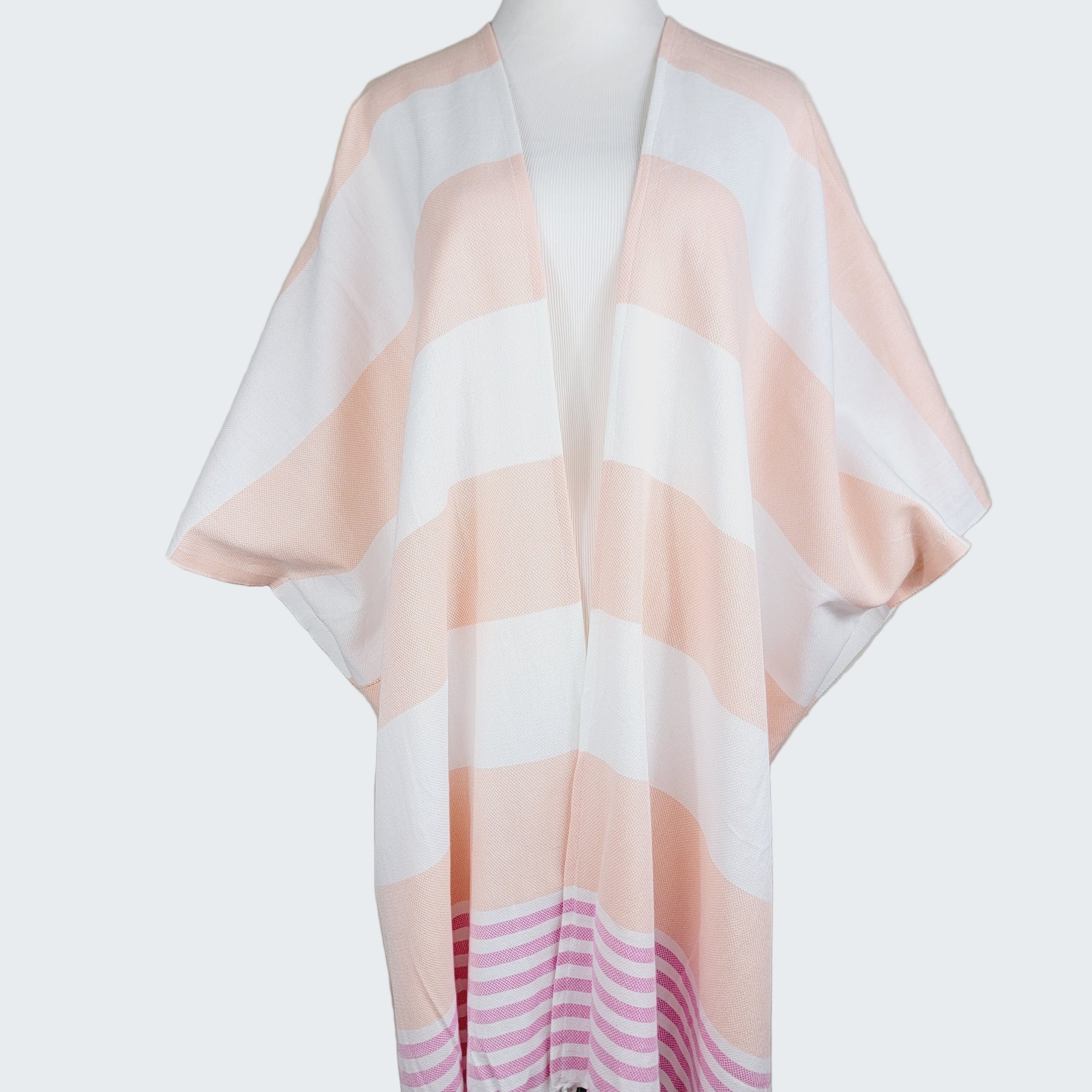 Striped scarf on a mannequin against a plain background