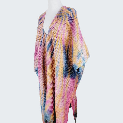 Colorful patterned scarf on a mannequin against a white background