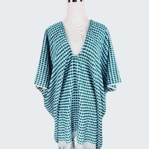 Teal and white checkered kimono-style garment on a mannequin against a beige background