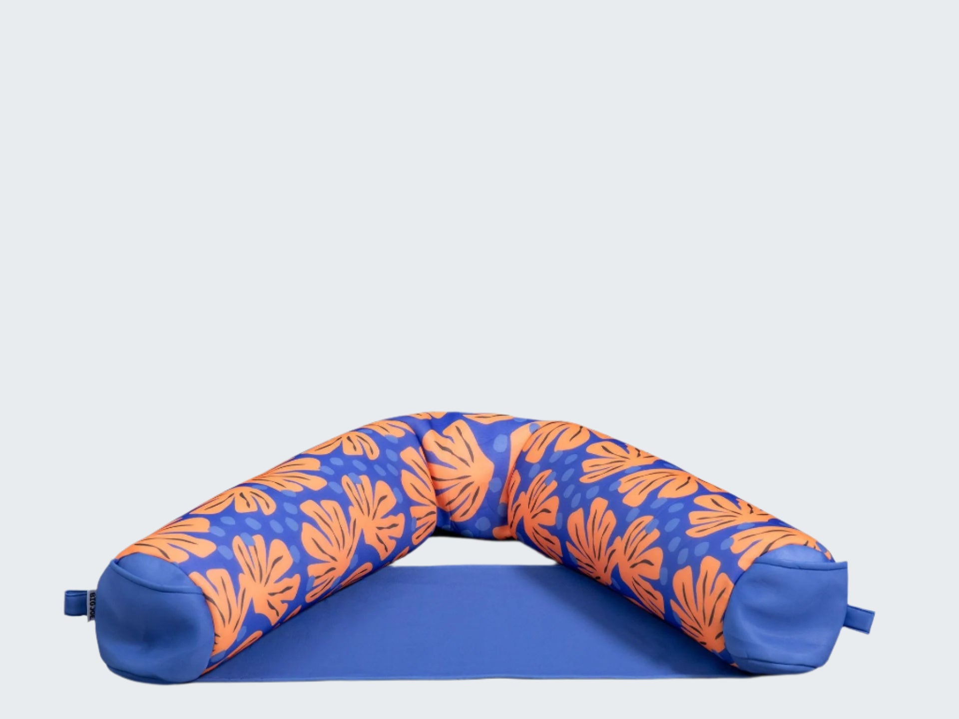 Blue and orange patterned neck pillow on a white background