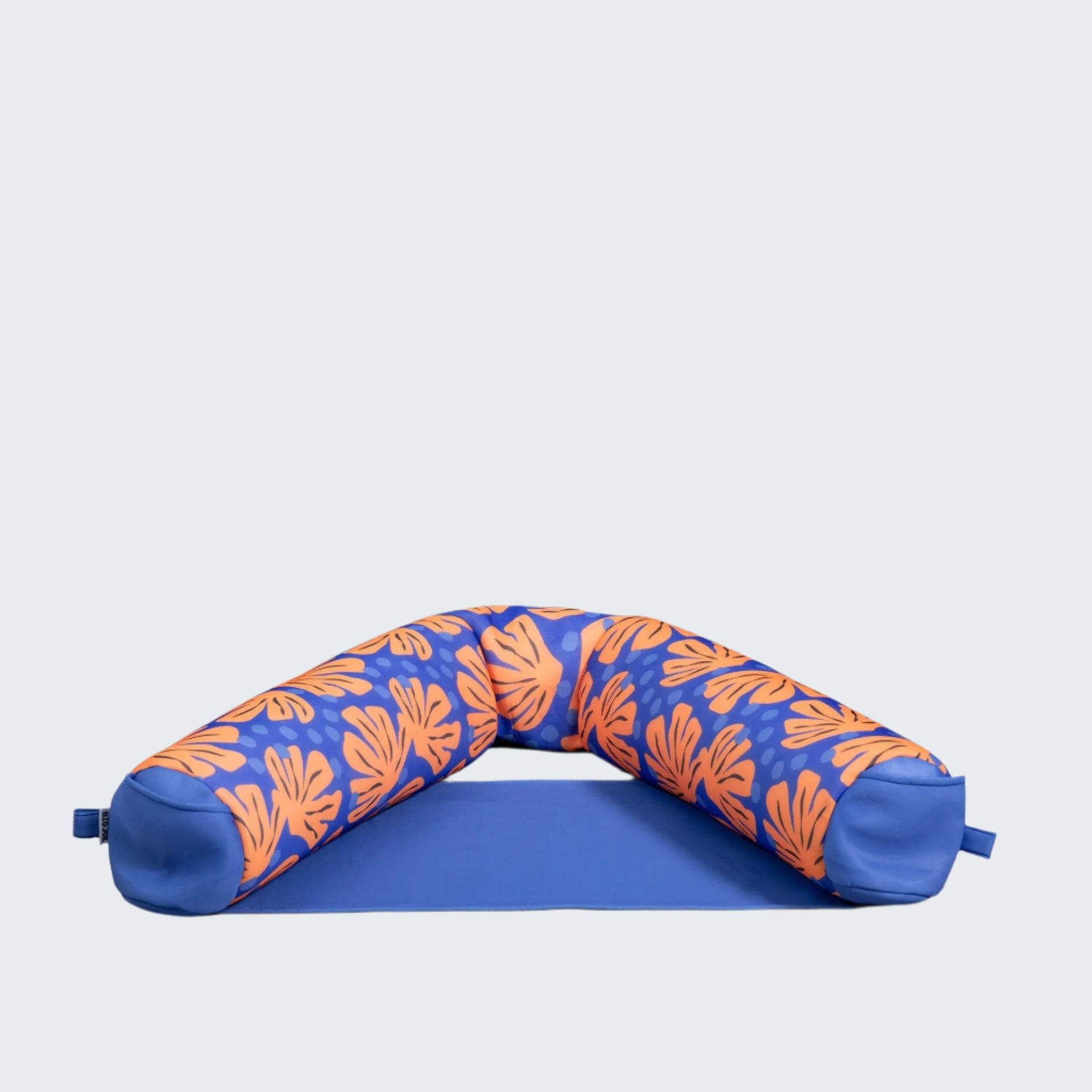 Blue and orange patterned neck pillow on a white background