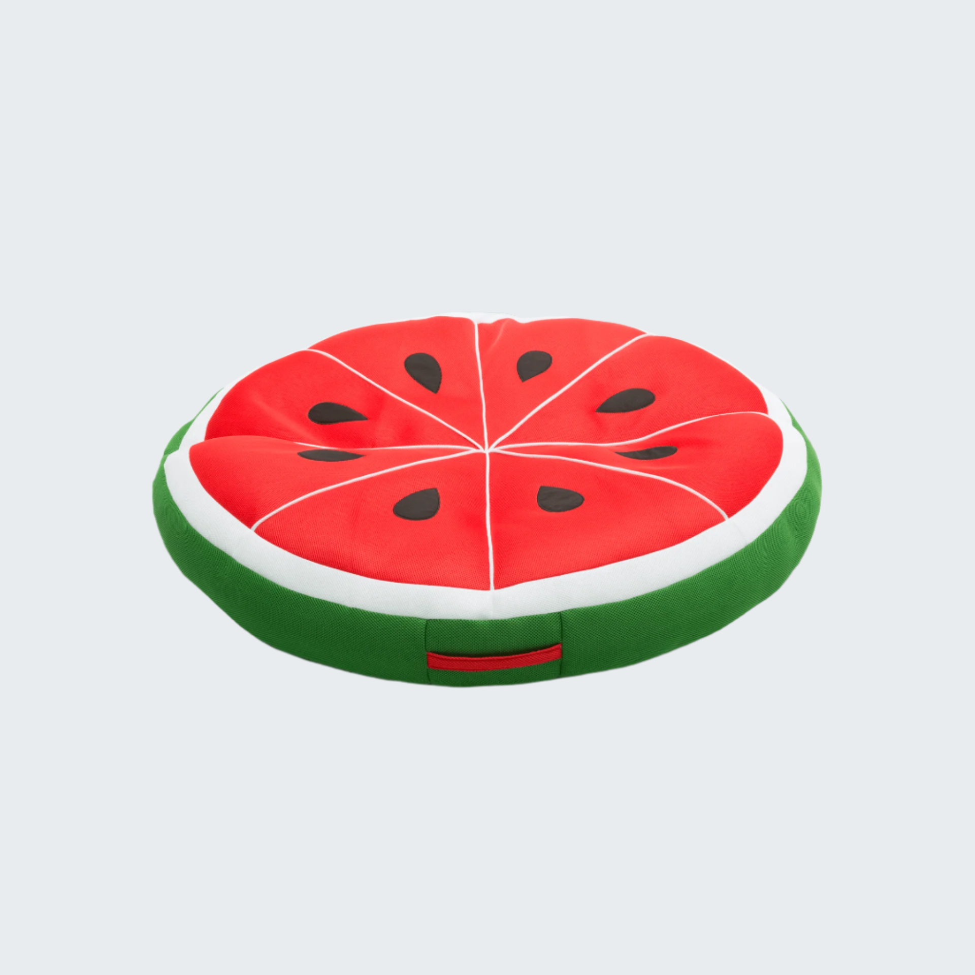 Watermelon slice-shaped cushion on a black background