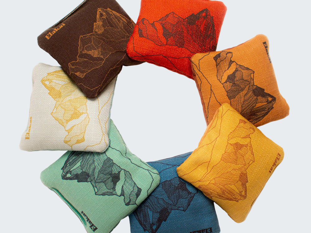 Set of colorful bean bags with bear designs on a white background