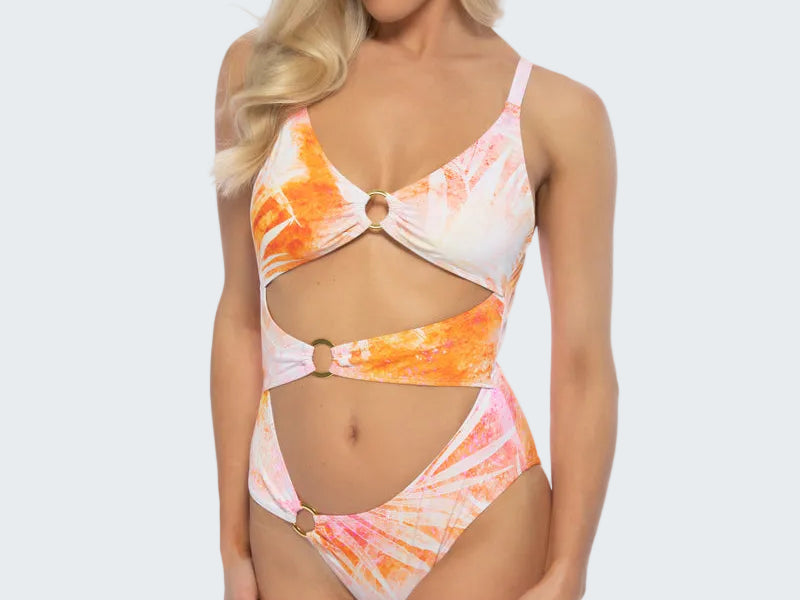 Woman wearing a colorful tie-dye swimsuit on a white background