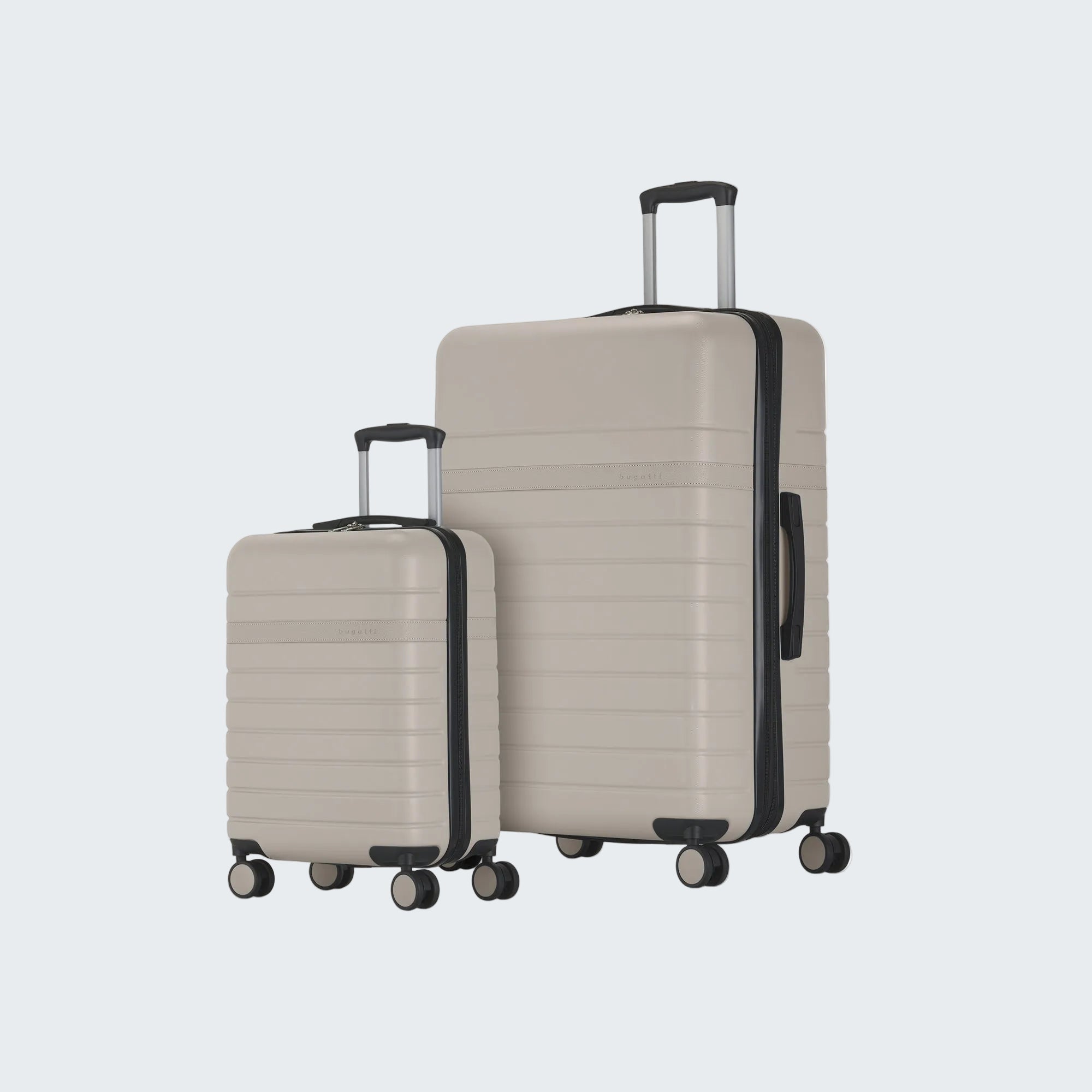 Two beige suitcases with black handles and wheels on a white background