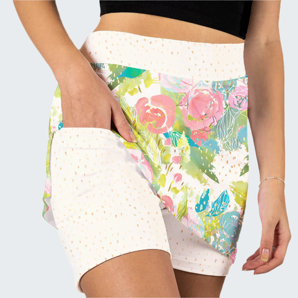 Floral patterned shorts with white accents worn by a person on a white background