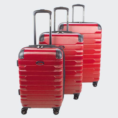 Three red suitcases of different sizes on a white background