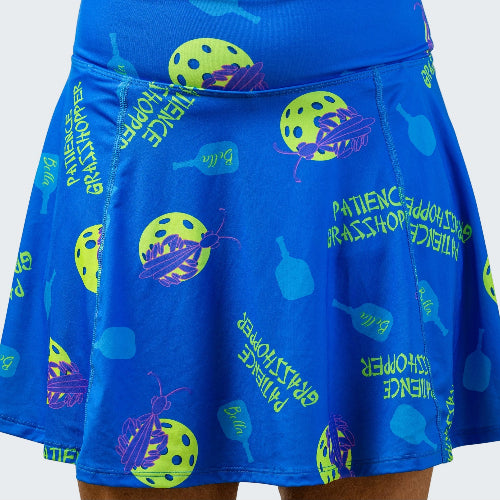 Blue skirt with pickleball-themed designs on a white background