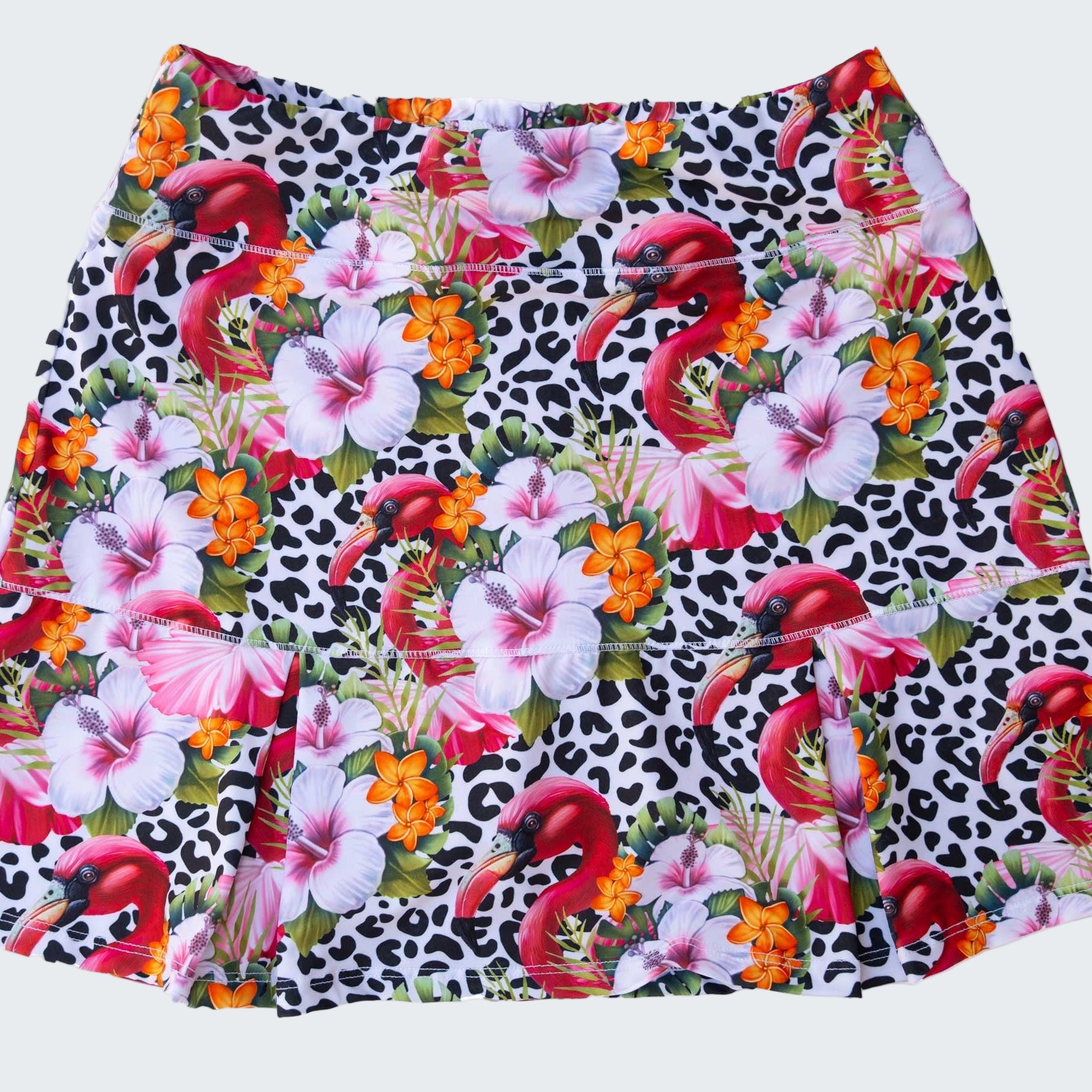 Skirt with flamingo and floral pattern on a white background