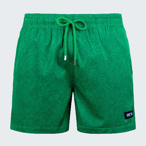 Green patterned shorts with a drawstring on a white background