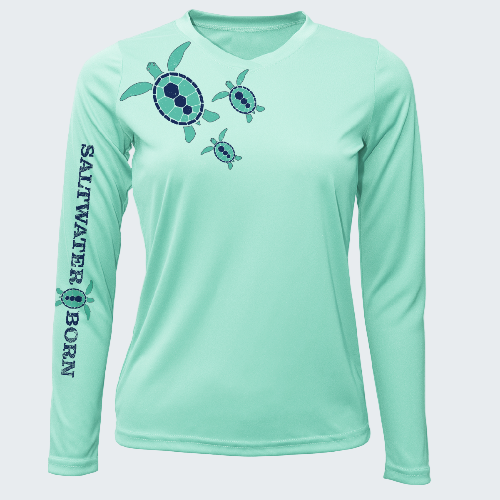 Mint green long-sleeve shirt with turtle design and 'Saltwater Born' text on a white background