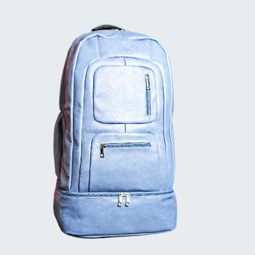 Light blue backpack with multiple zippers on a red background