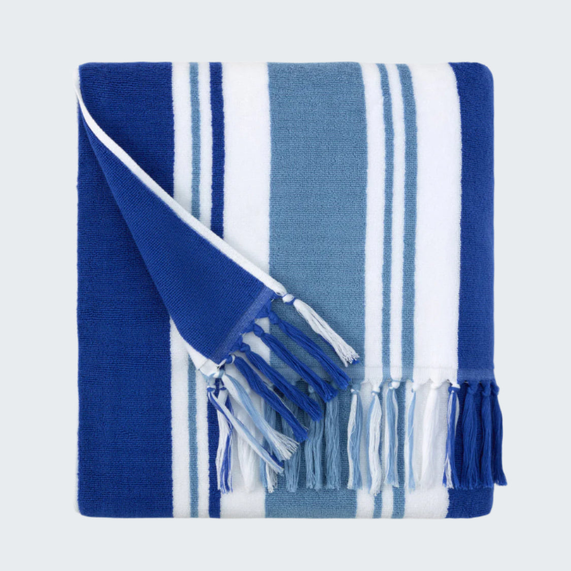 Blue and white striped towel with tassels on a white background