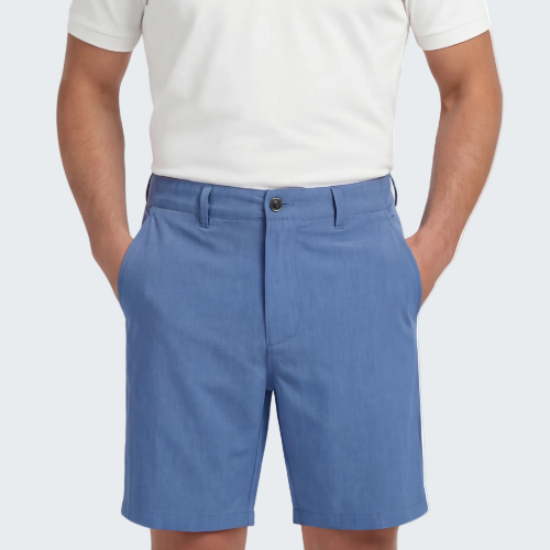 Person wearing blue shorts and a white polo shirt on a white background