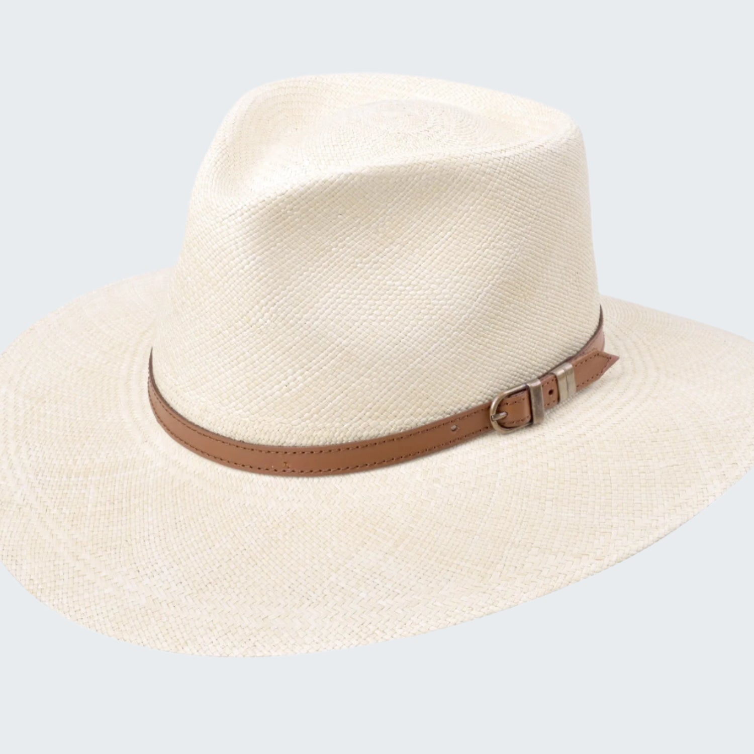 Beige straw hat with a brown band on a white background