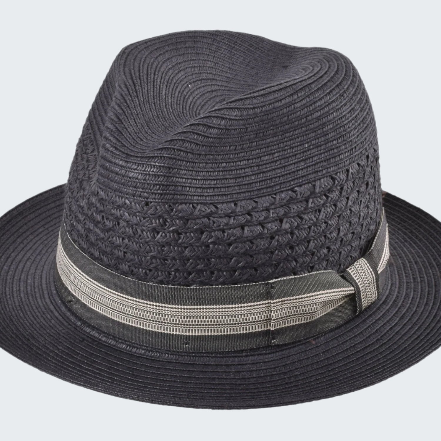 Black straw hat with a band on a white background