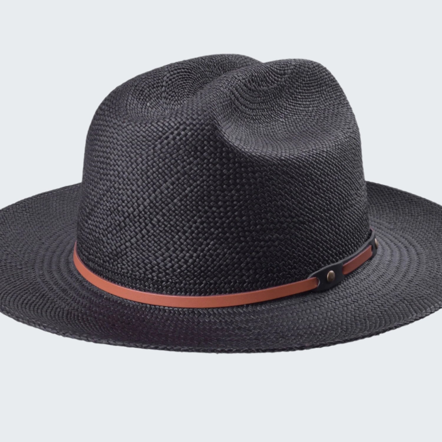Black straw hat with a brown band on a white background
