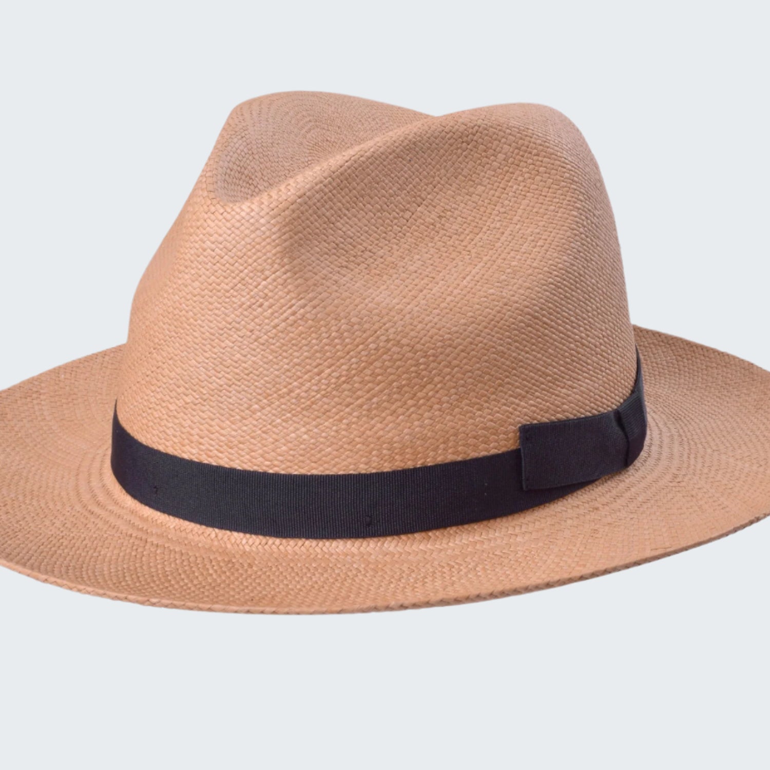Beige straw hat with a black band on a white background