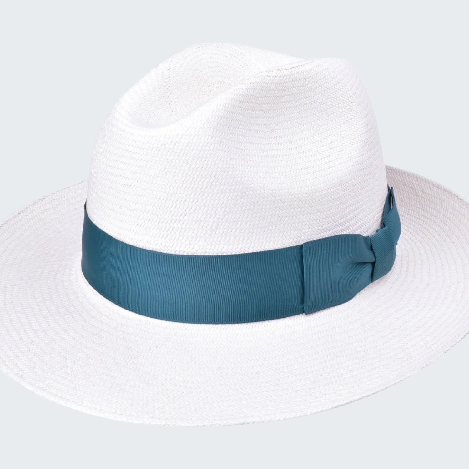 White straw hat with a blue band on a white background