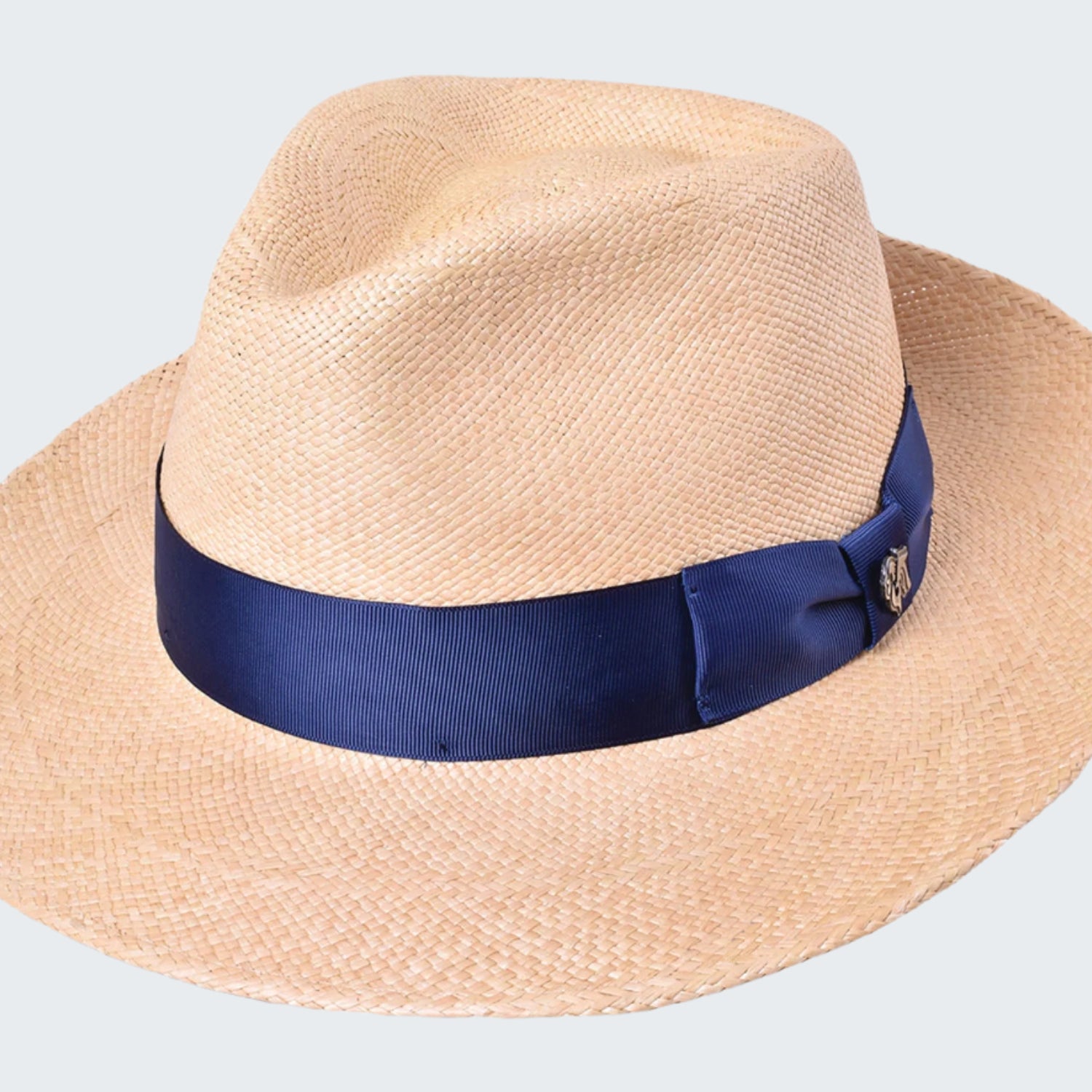 Beige straw hat with a blue band on a white background