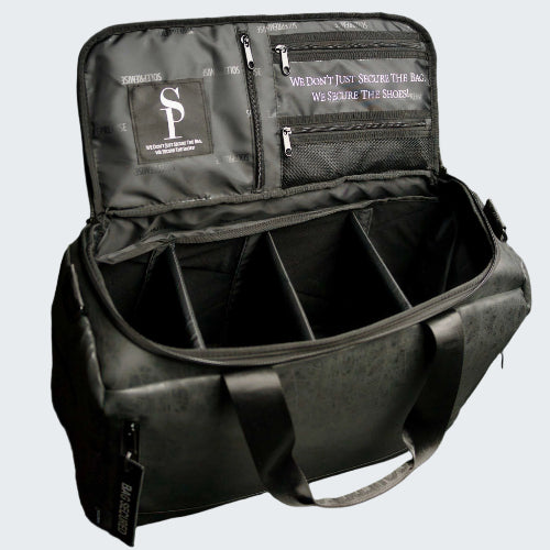 Black backpack with compartments and visible branding on a dark background