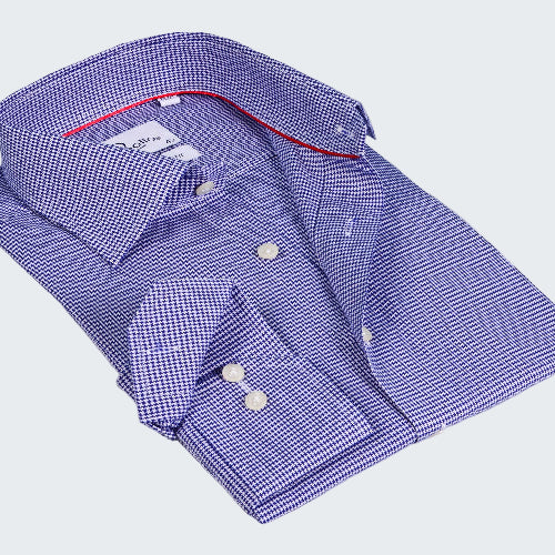 Folded blue checkered shirt with red interior on a white background