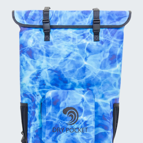 Blue water-patterned backpack with 'Dry Pocket' logo on a light gray background