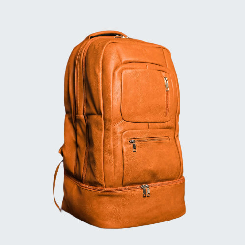 Orange leather backpack on a red background