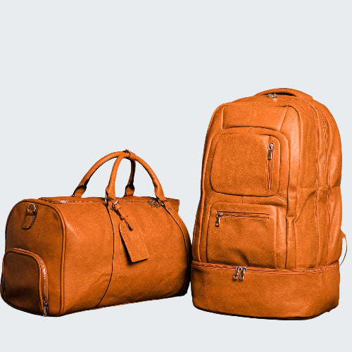 Two brown leather bags, a duffel bag and a backpack, against a red background.