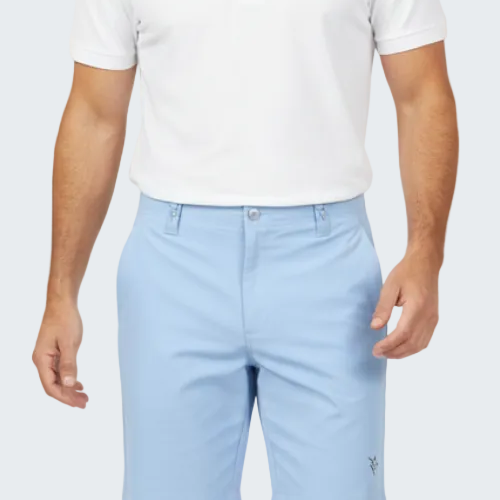 Person wearing light blue shorts and a white polo shirt on a white background