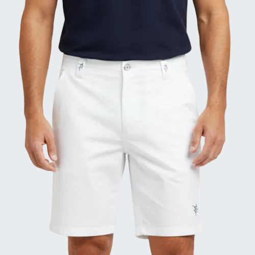 Person wearing white shorts and a navy polo shirt on a white background