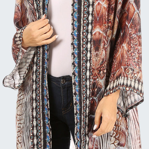 Long, patterned cardigan worn by a person on a white background