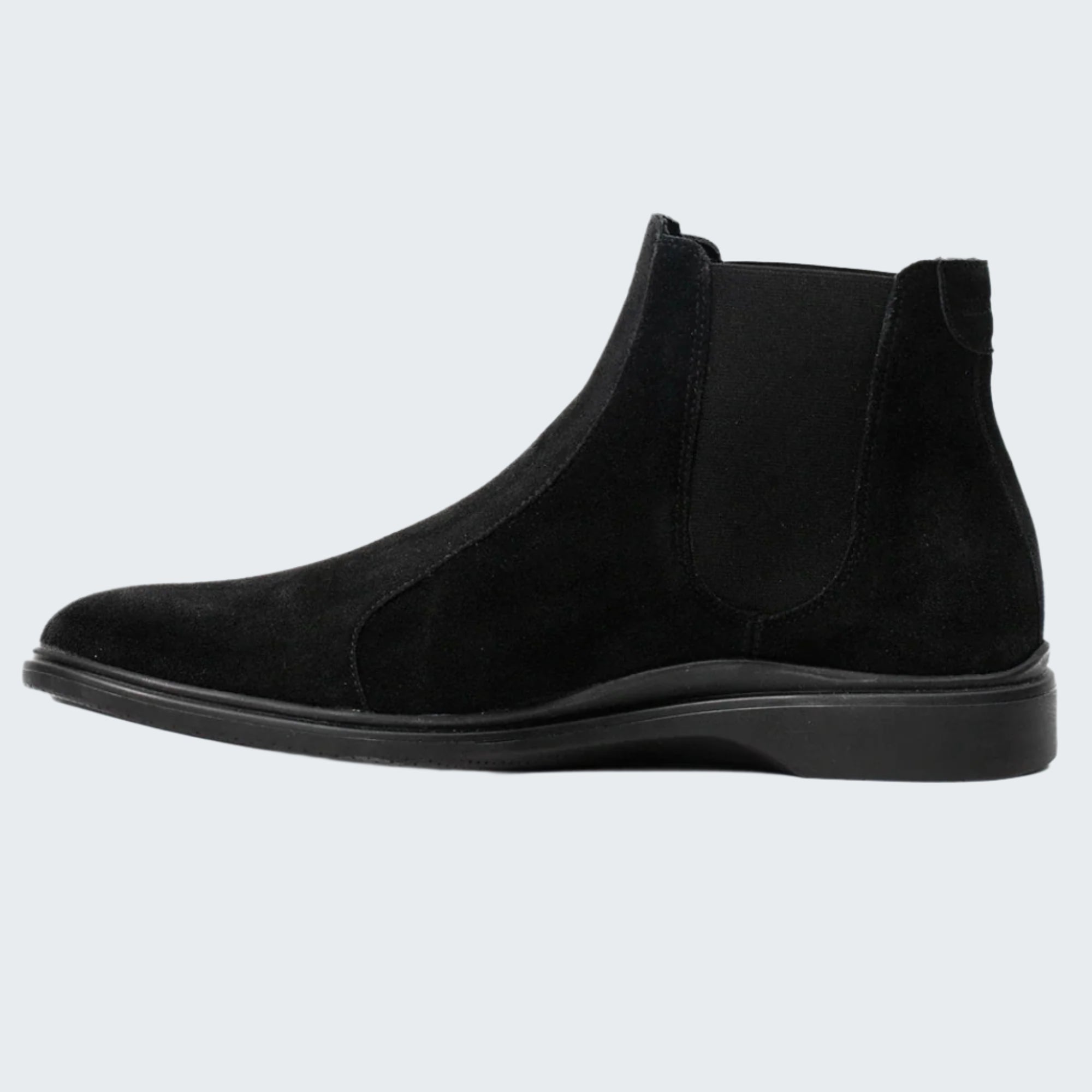 Black suede Chelsea boot on a white background