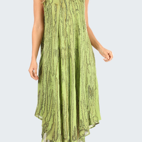 Green patterned dress worn by a model on a white background
