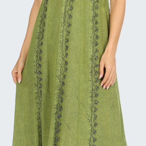 Green maxi dress with lace details on a white background