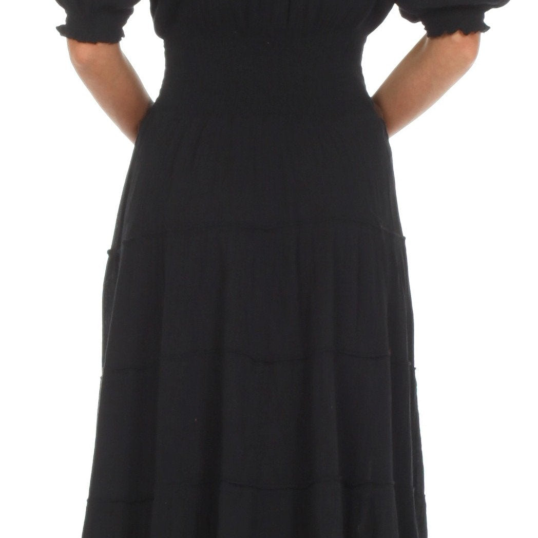Black off-shoulder dress on a white background