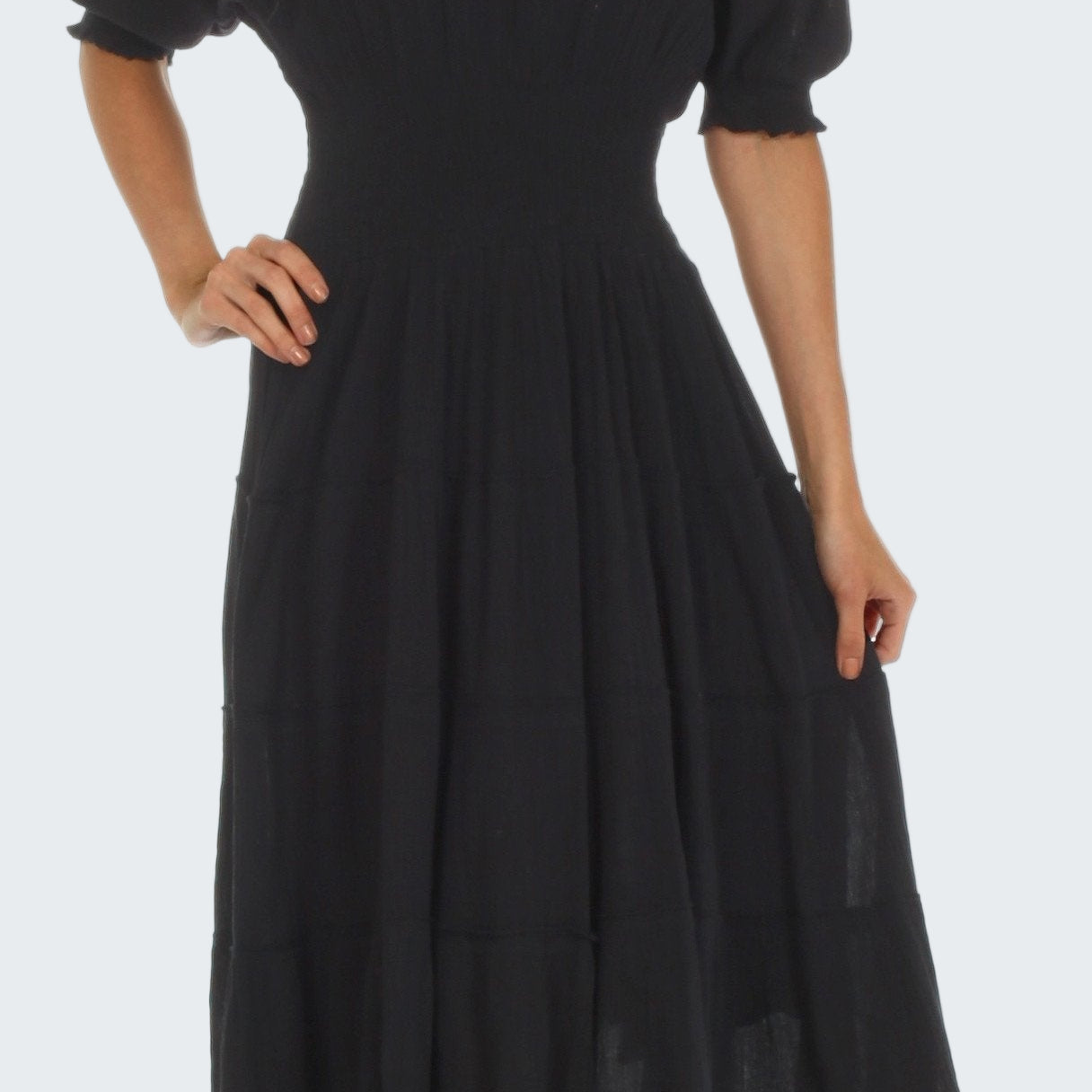 Black off-shoulder dress on a white background