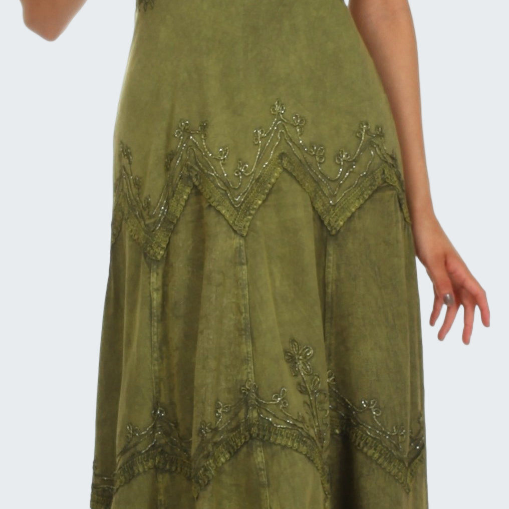Green dress with intricate patterns on a white background
