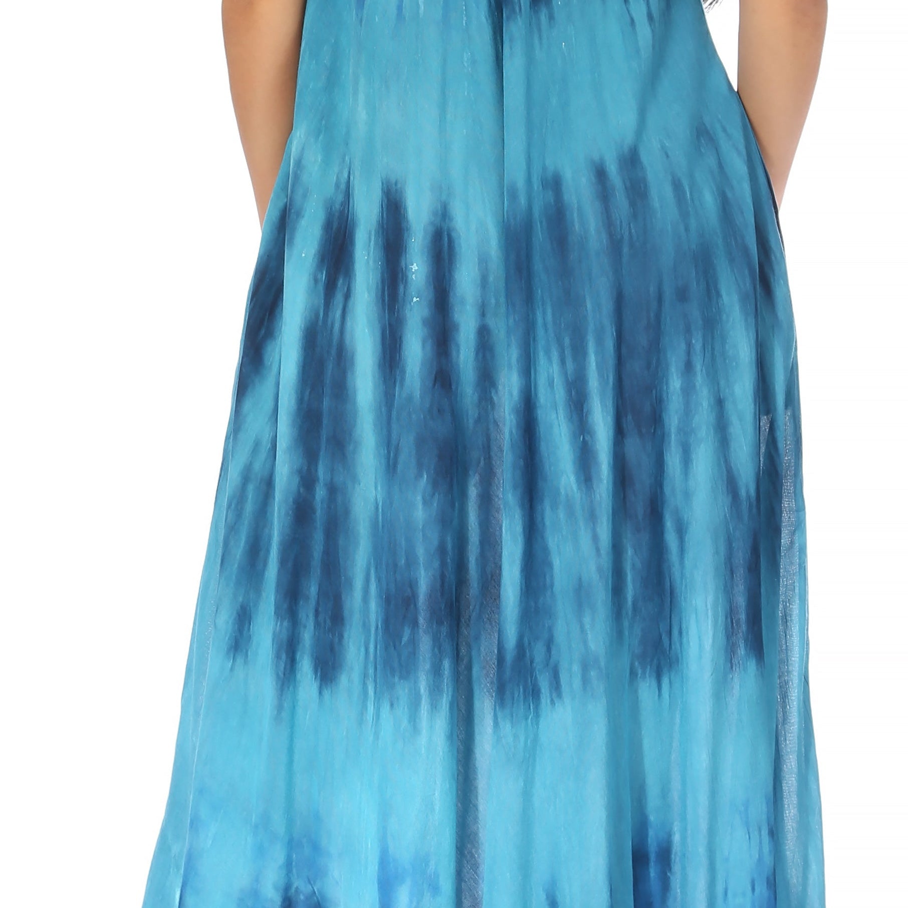 Woman wearing a blue tie-dye dress on a white background
