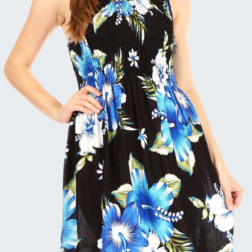 Woman wearing a black dress with blue floral pattern on a white background